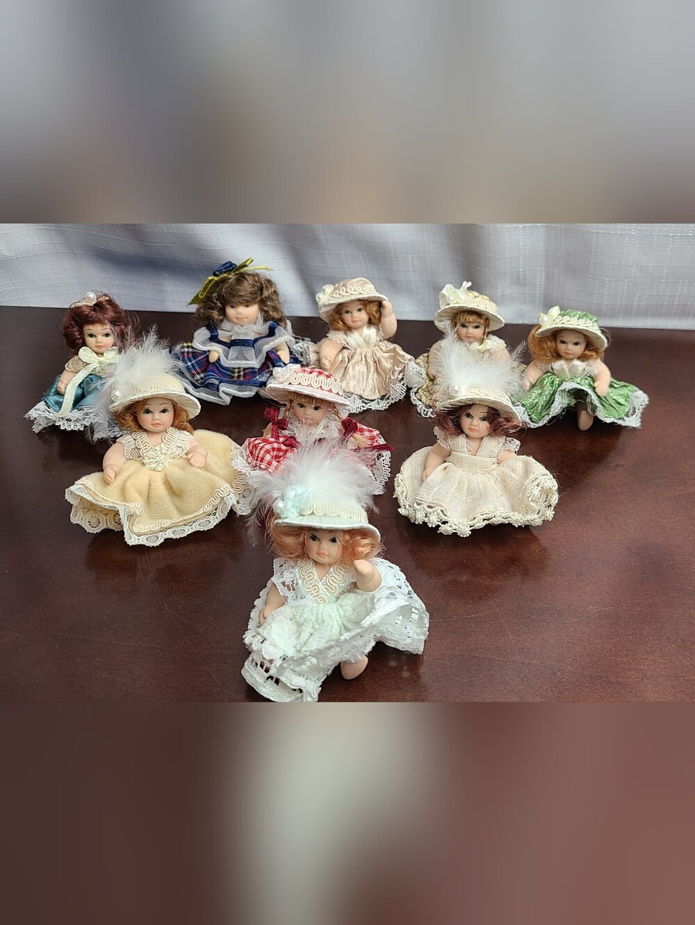 Set Of 9 Miniature Porcelain Dolls in Fancy Dresses
